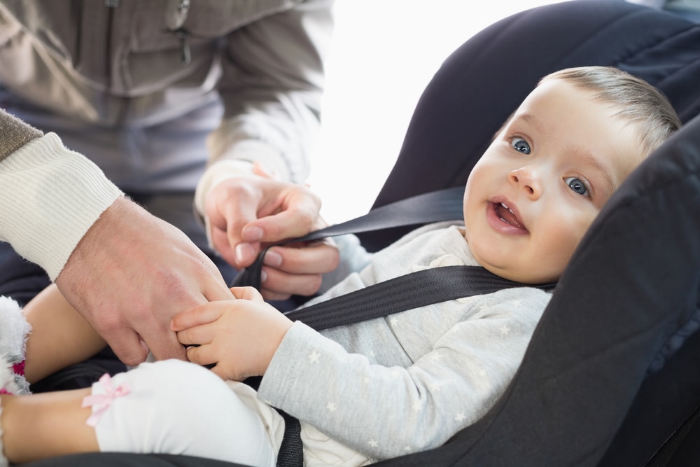 putting baby in car seat