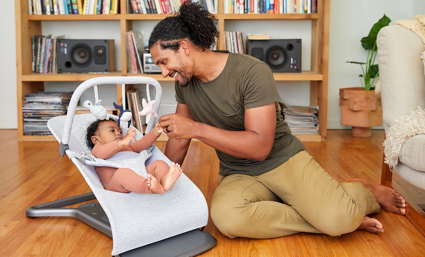 Ergobaby Evolve Bouncer - father looking at his newborn