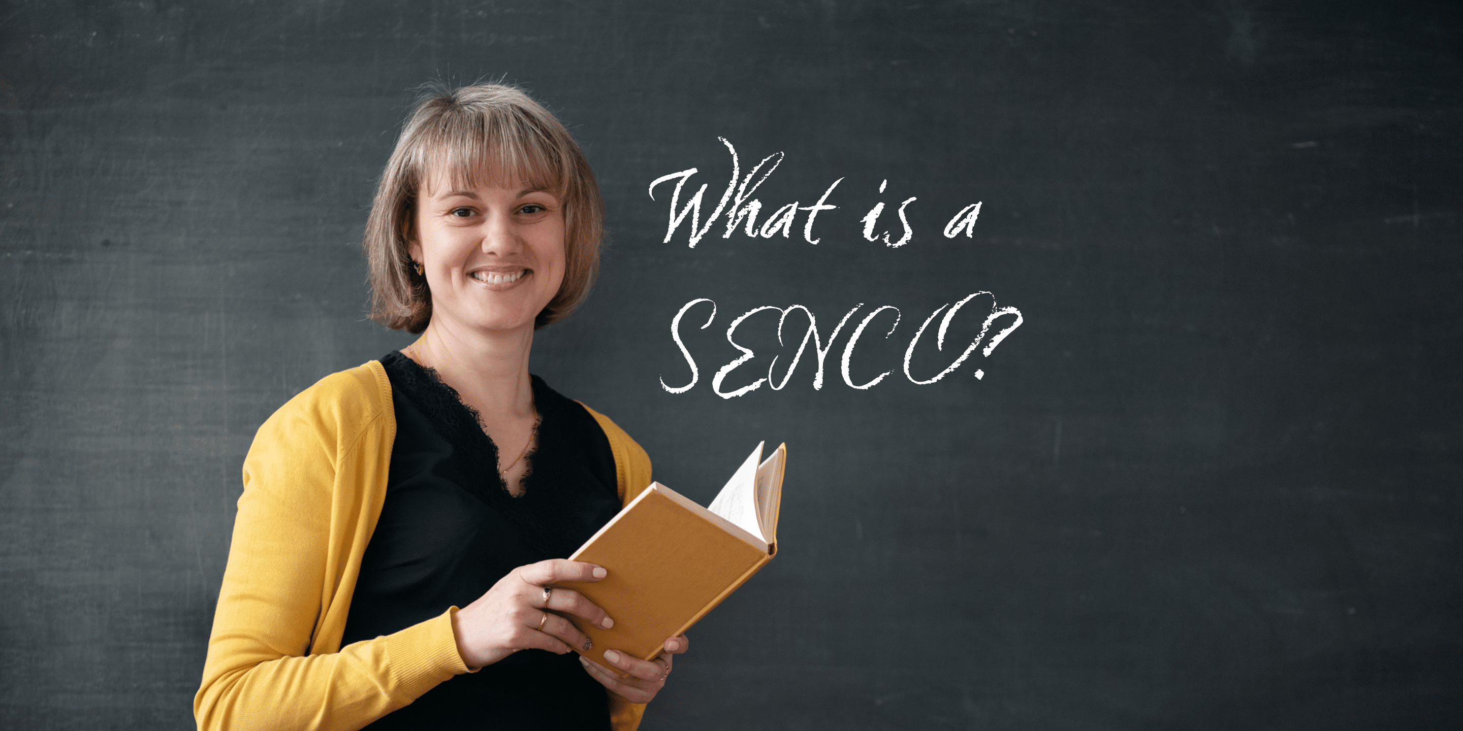 What is a SENCO? Teacher standing near blackboard