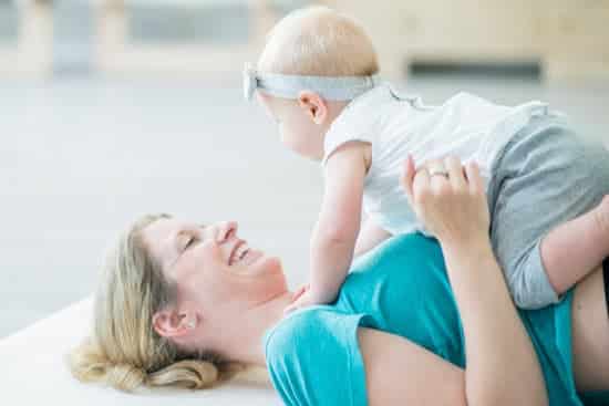 Mum doing yoga with a baby